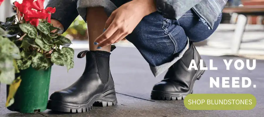 person wearing original black 510 chelsea blundstone boots
